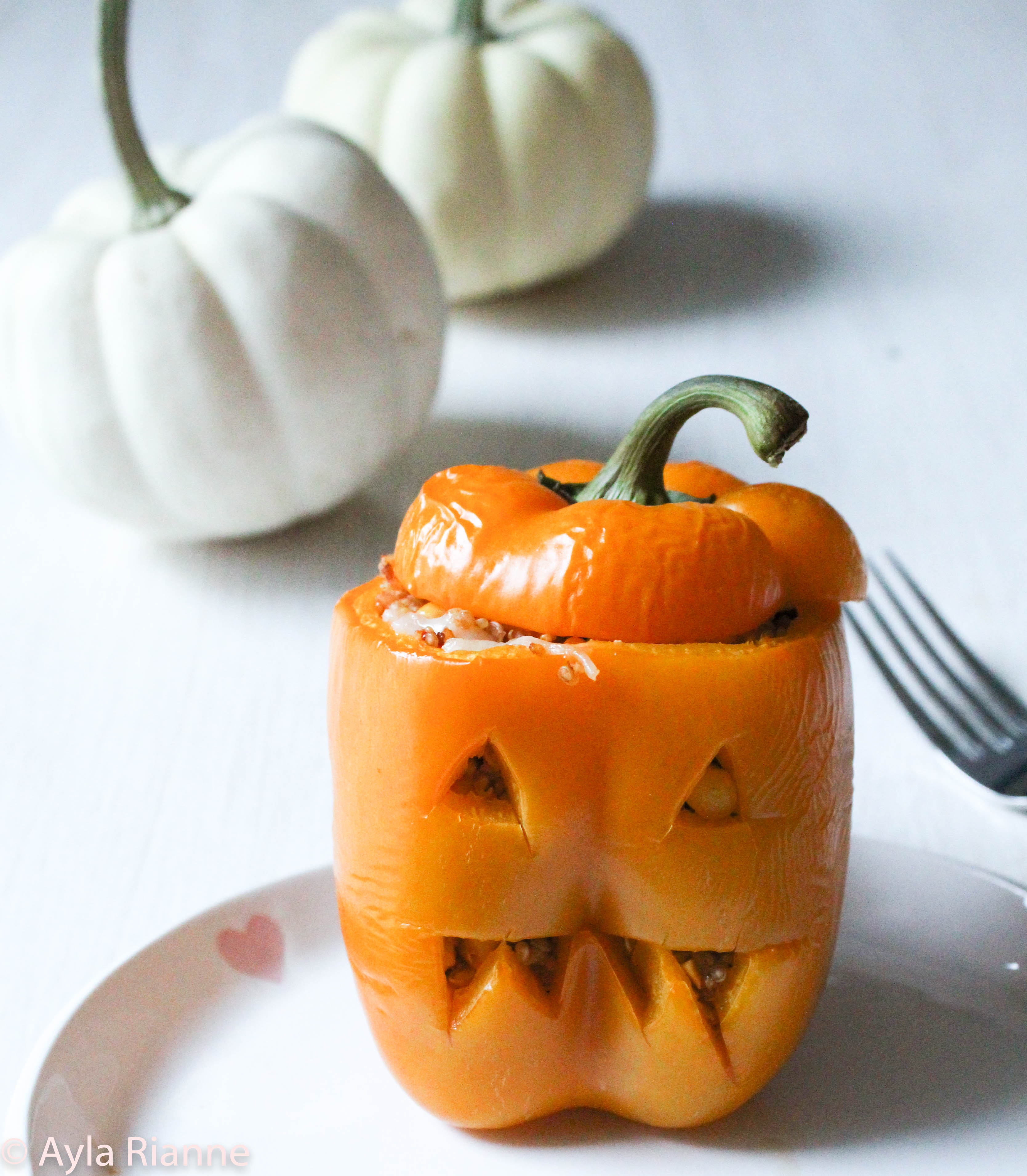 Vegan Jack O' Lantern Stuffed Peppers #stuffedpeppers #veganstuffedpeppers