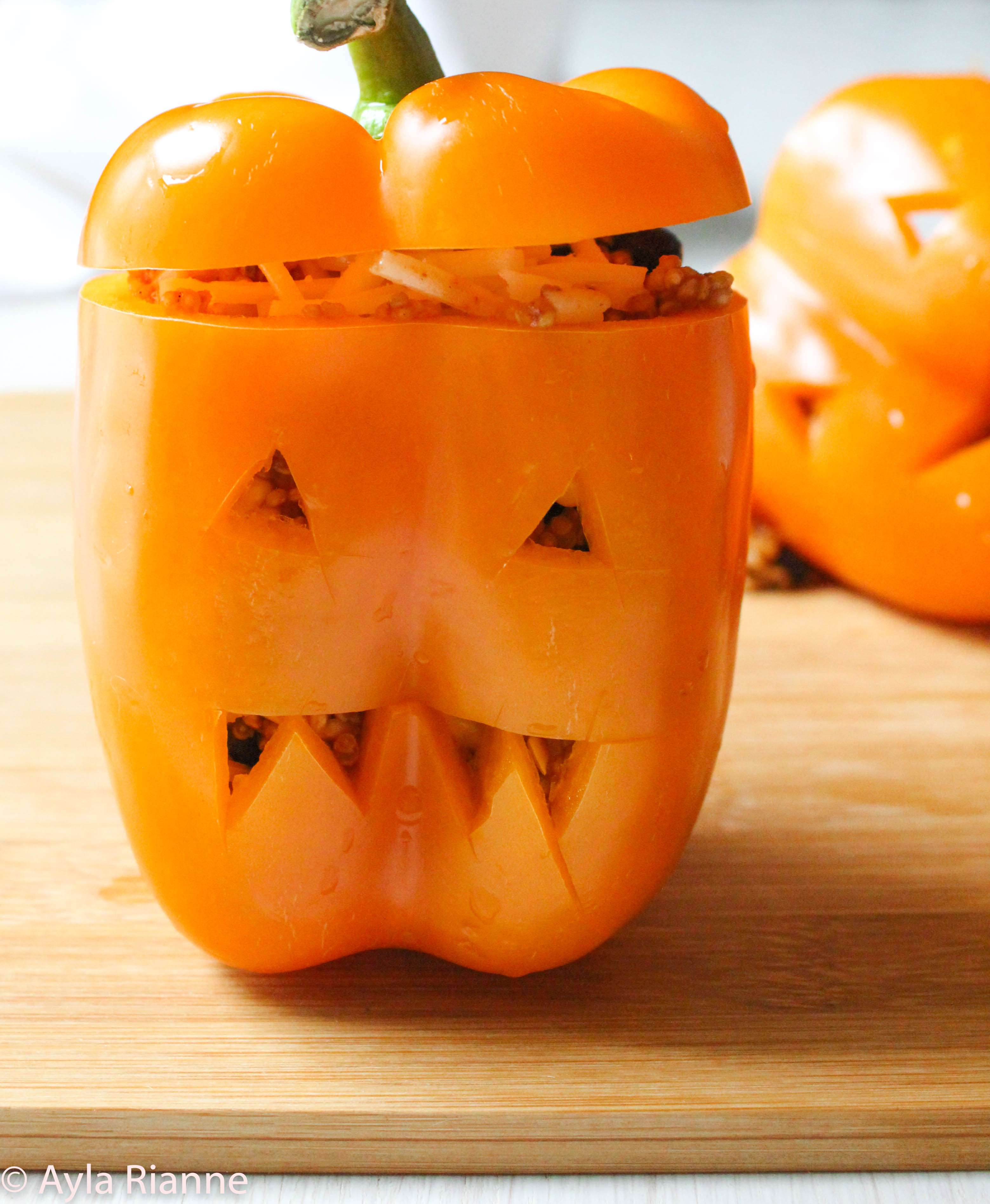 Vegan Jack O' Lantern Stuffed Peppers #stuffedpeppers #veganstuffedpeppers
