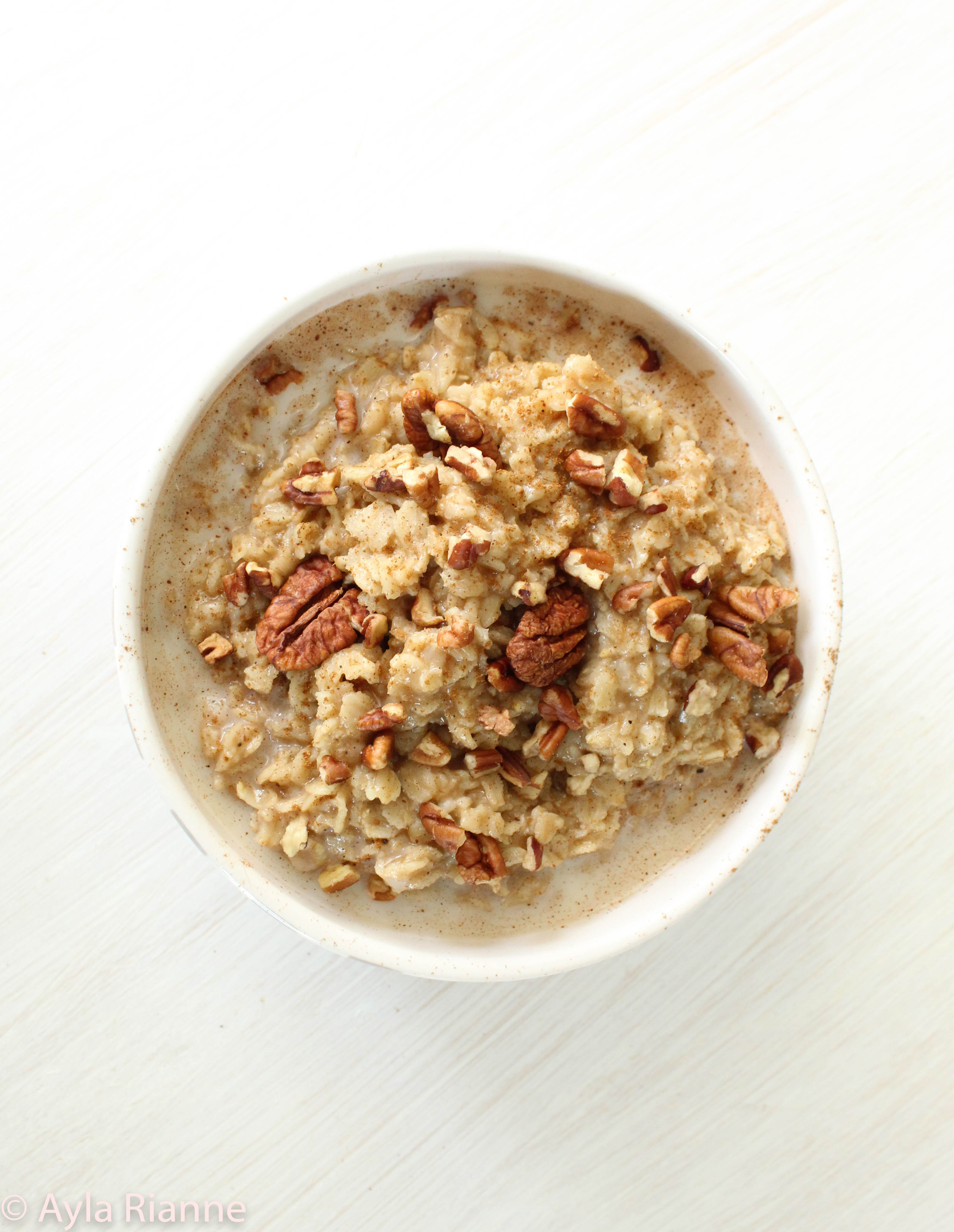 Vanilla Chai Spiced Oatmeal topped with pecans and almond milk #oatmeal #chaispice