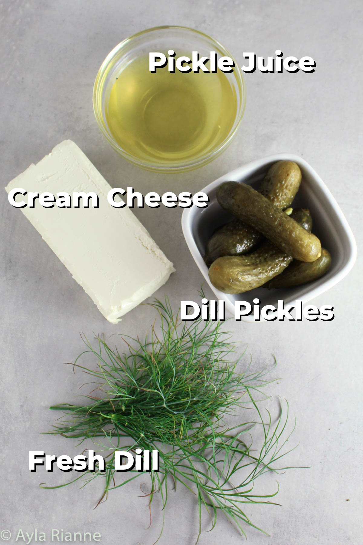 ingredients for dill pickle dip: pickly juice, cream cheese, pickles, and fill