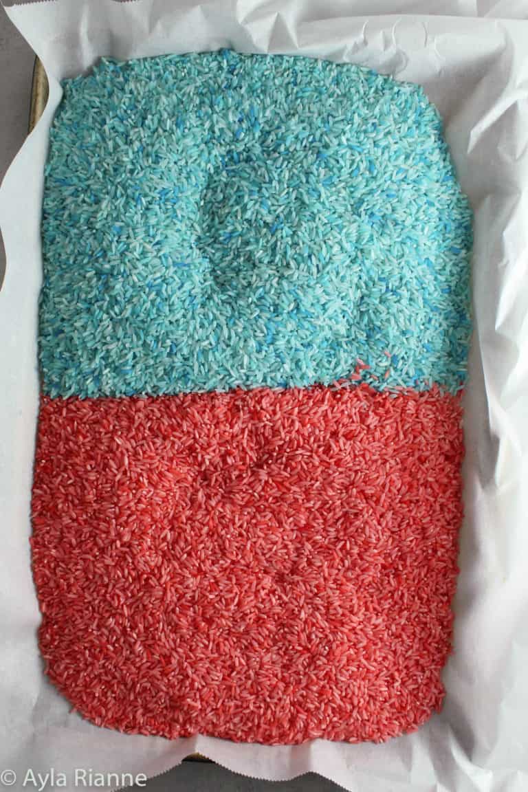 colored rice on a baking pan