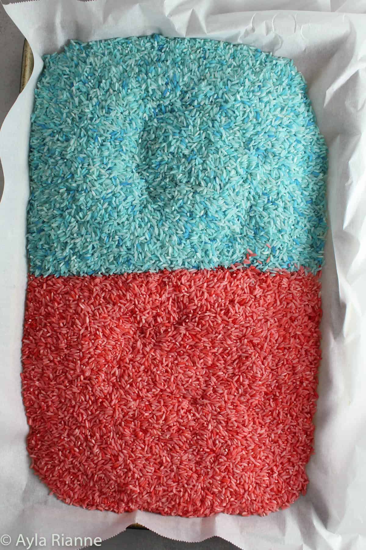 red and blue colored rice on a baking pan