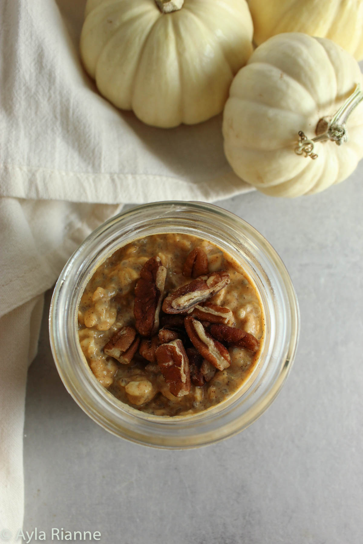 top view of pumpkin pie overnight oats with pecans on top