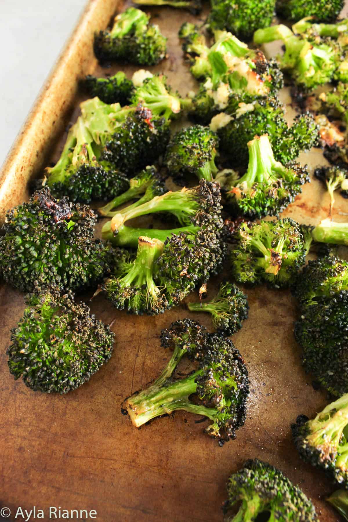 roasted broccoli on a baking pan