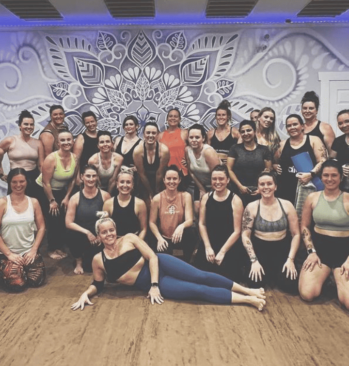 a group of women posing for a photo