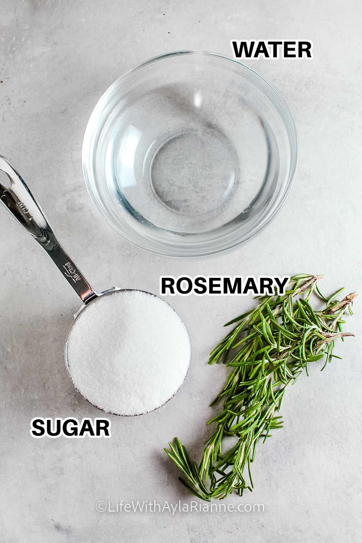 water, sugar , and rosemary with labels to make Rosemary Simple Syrup