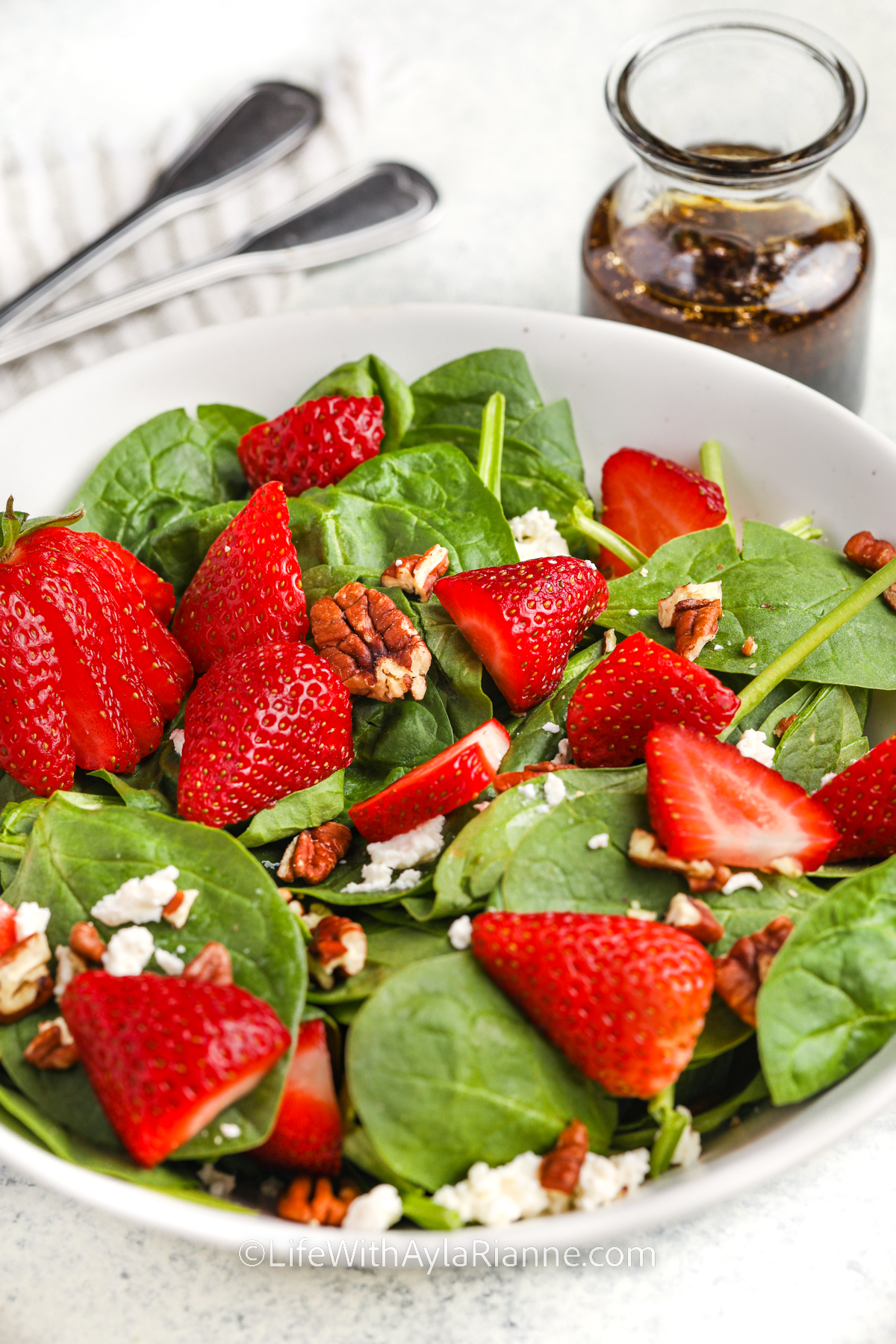close up of Strawberry Spinach Salad Recipe with vinaigrette