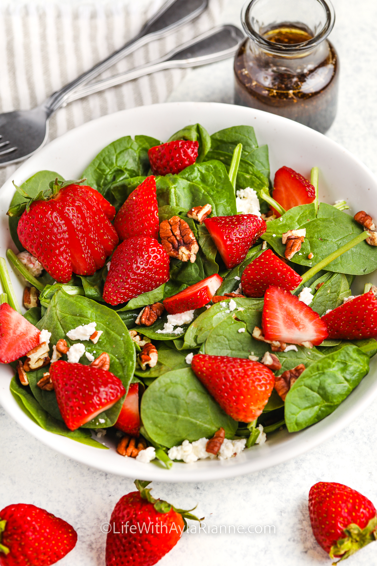 bowl of Strawberry Spinach Salad Recipe with pecans