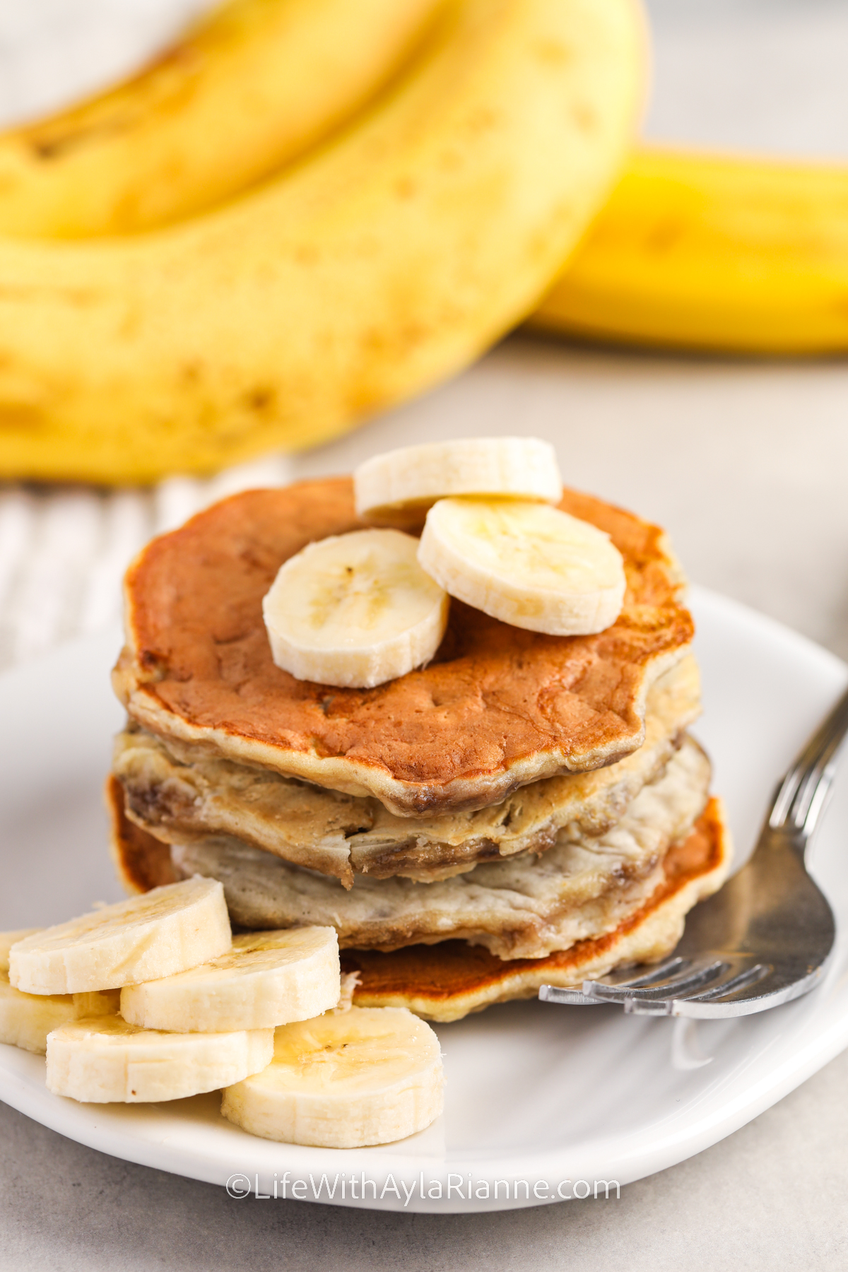 plated 3 Ingredient Banana Pancakes with a fork