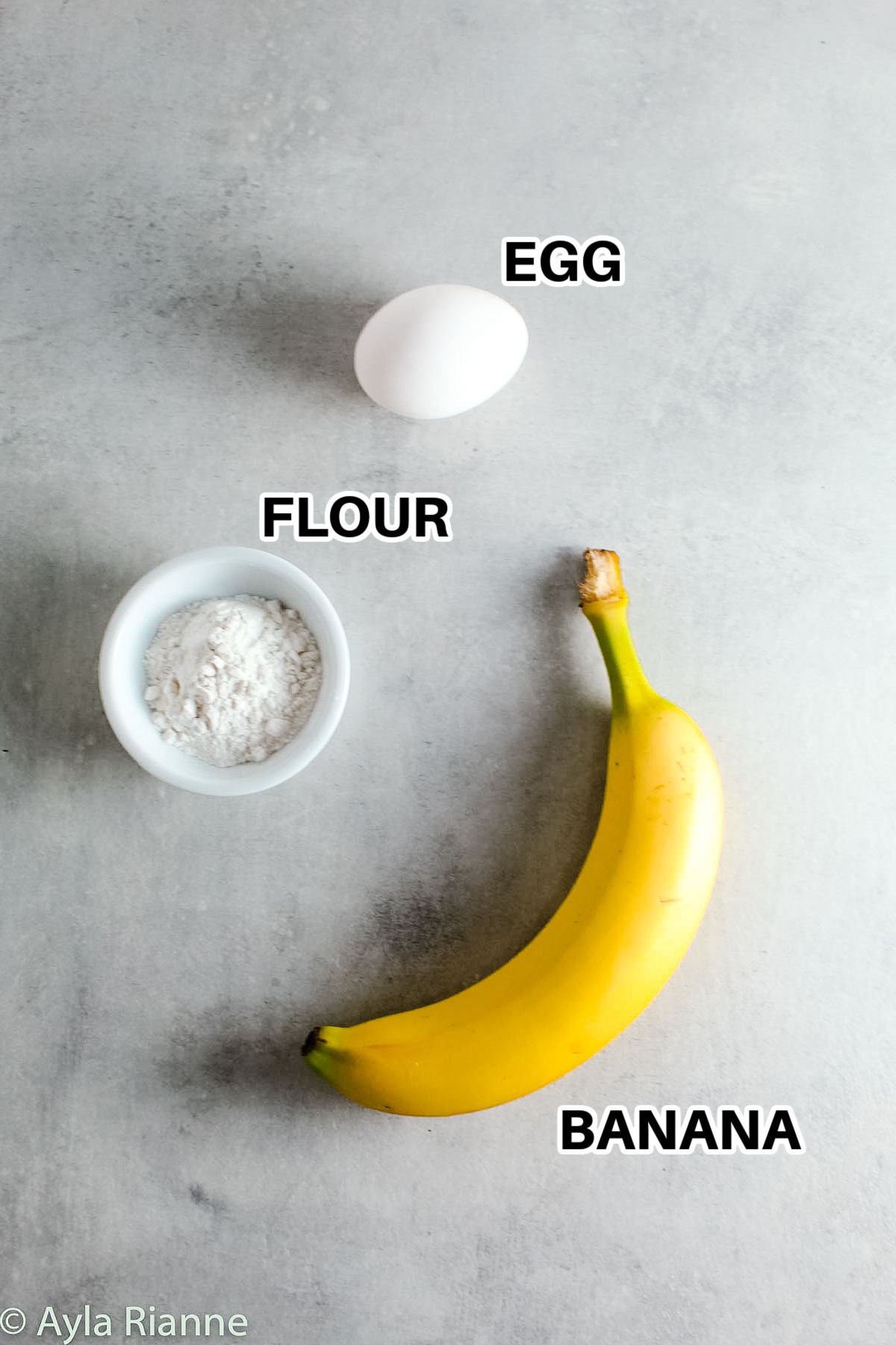 egg , flour and banana with labels to make 3 Ingredient Banana Pancakes
