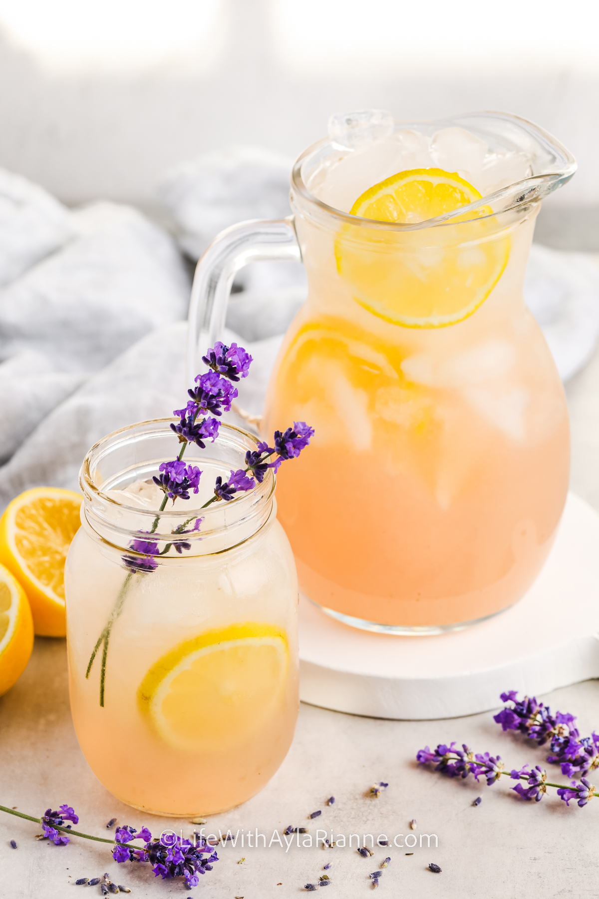 pitcher and glass full of Lavender Lemonade Recipe