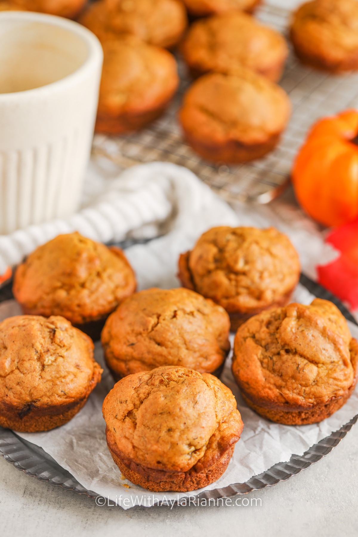 muffins on a plate with coffee in the background