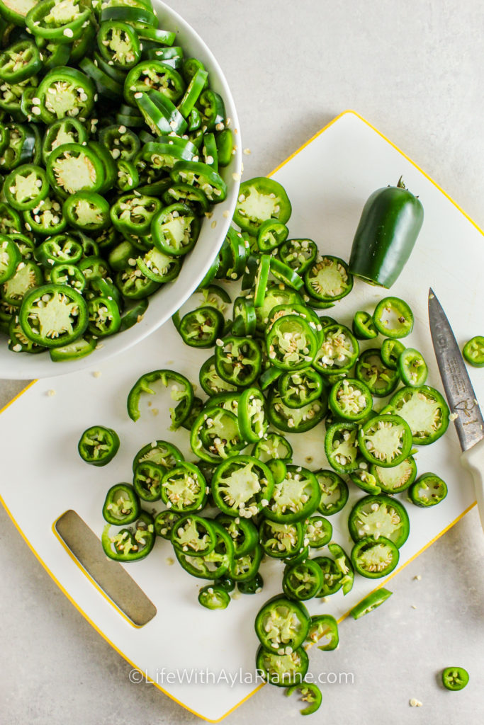 cutting jalapenos to make Candied Jalapeños