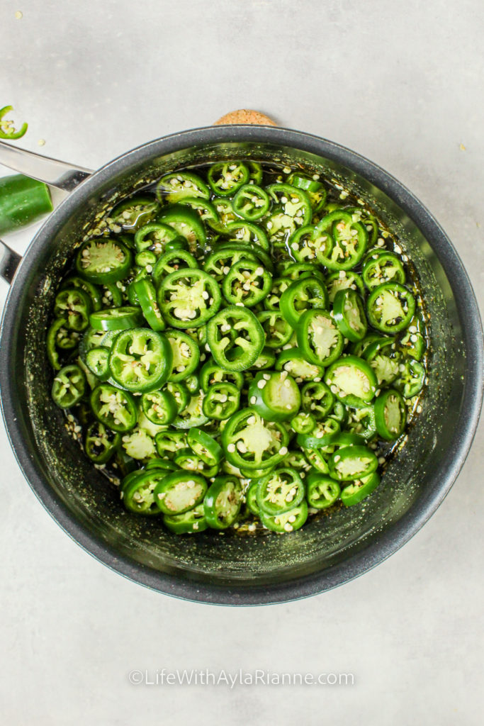 jalapenos in a pot to make Candied Jalapeños