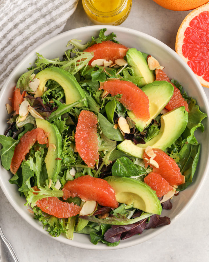 plated Grapefruit Salad with salad dressing in jar
