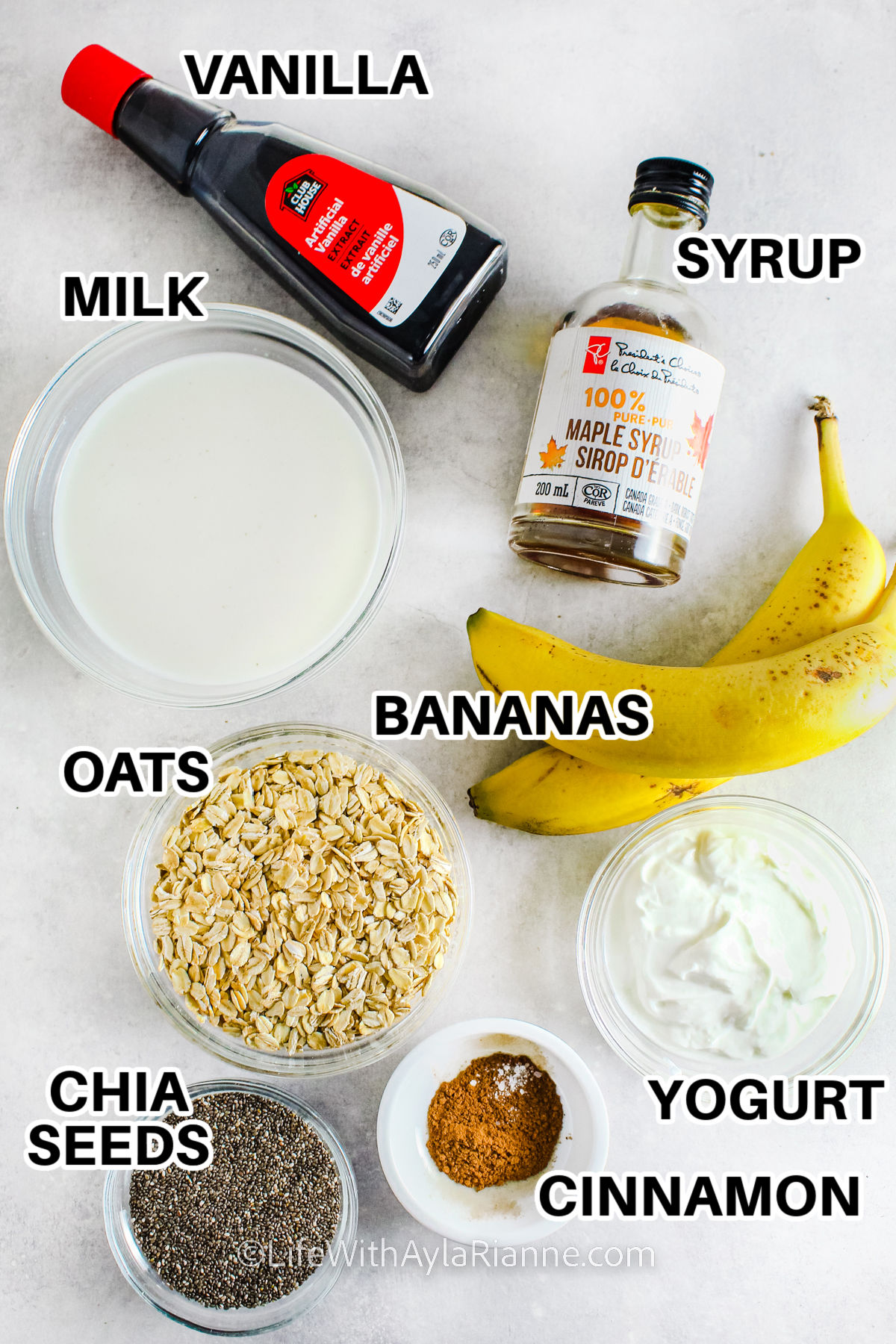 vanilla , syrup , milk , bananas , oats , chia seeds , yogurt and cinnamon to make Banana Bread Overnight Oats with labels