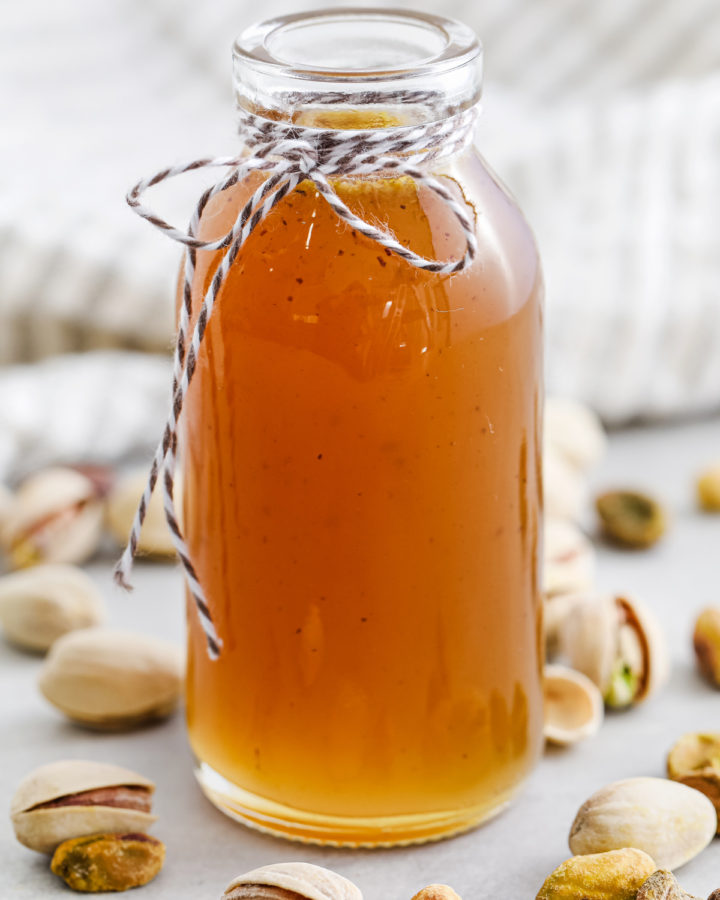 Pistachio Syrup in a jar with a ribbon