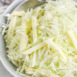 Apple Fennel Slaw in a bowl with a spoon