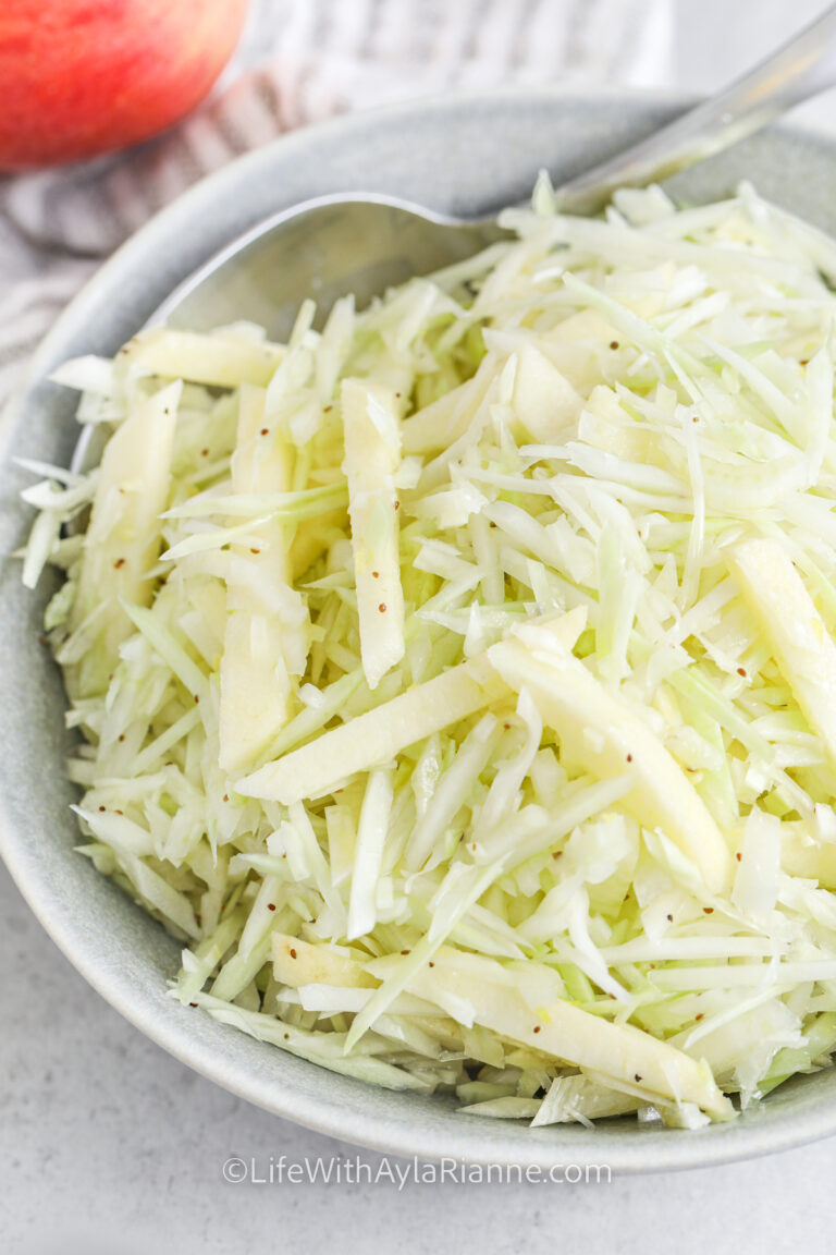 Apple Fennel Slaw in a bowl with a spoon