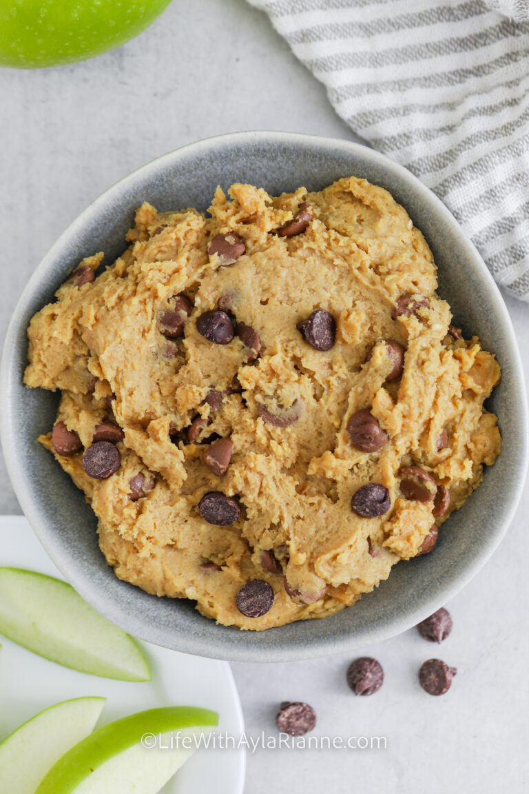 Chickpea Cookie Dough in a bowl with slices of apple on the side