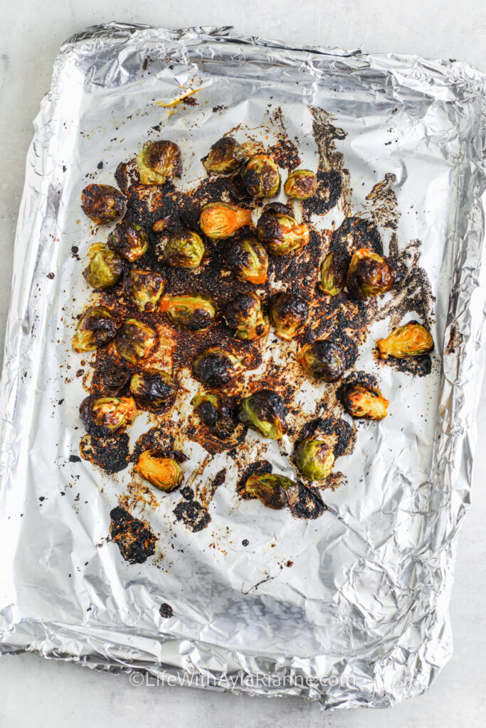 cooked Honey Sriracha Brussels Sprouts on a sheet pan