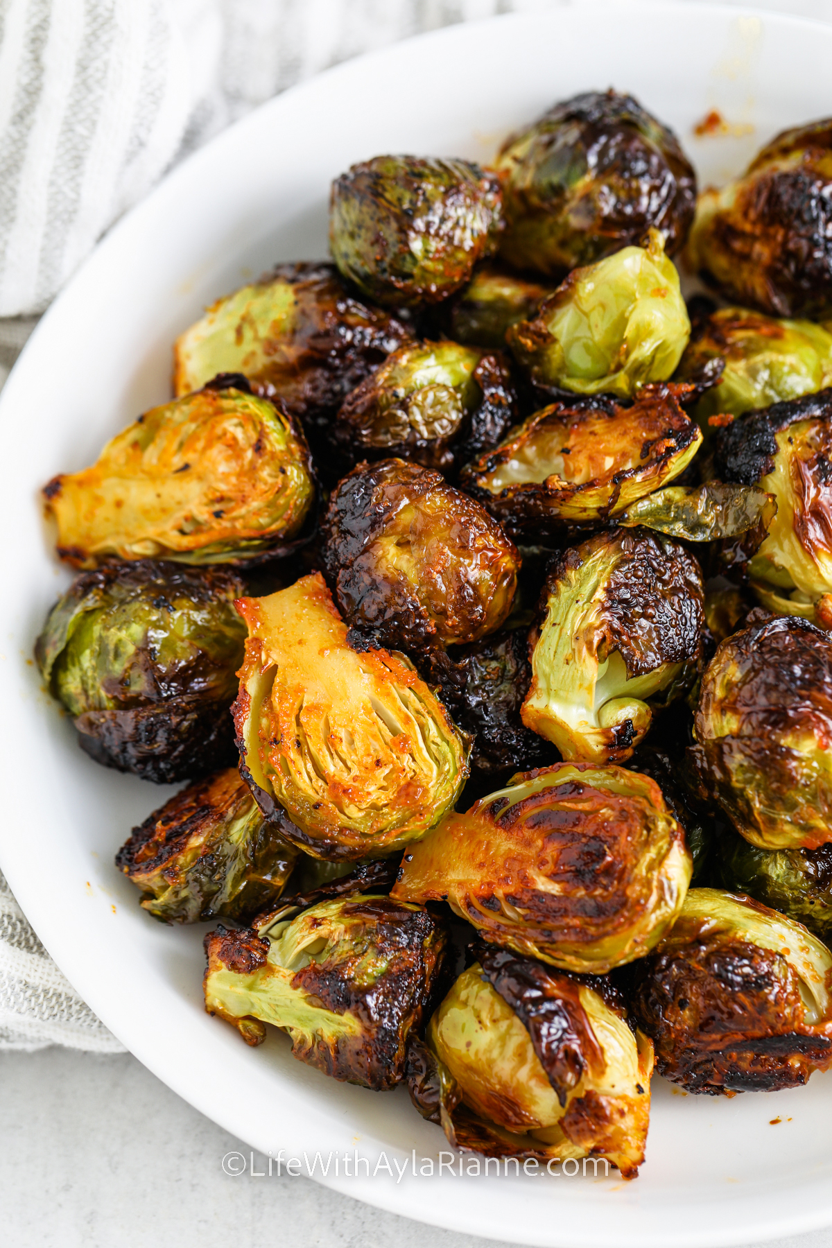cooked Honey Sriracha Brussels Sprouts on a plate