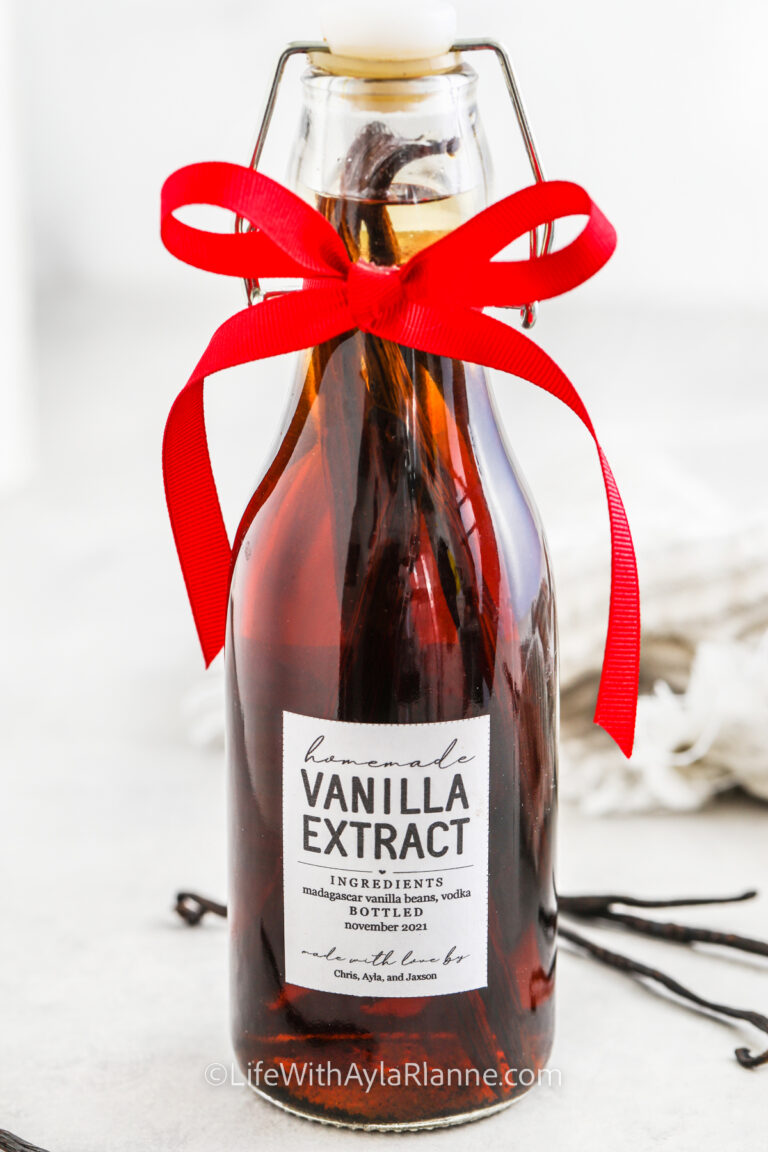 a bottle of homemade vanilla with a label and a bow for how to make vanilla