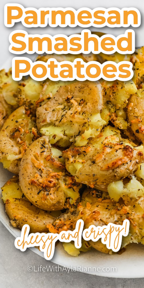close up of parmesan smashed potatoes on a plate with writing