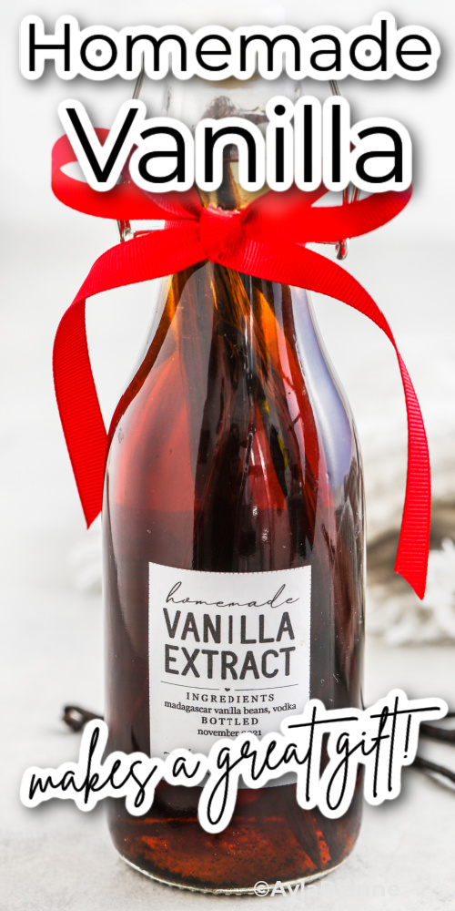 a bottle of homemade vanilla with a red bow and writing