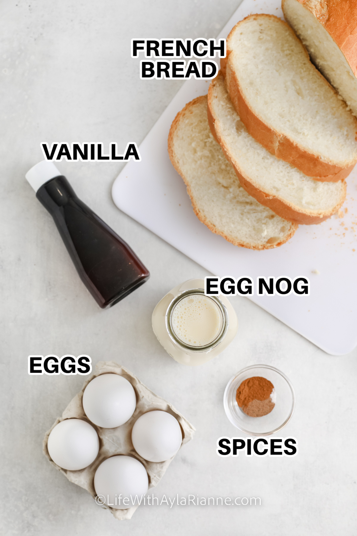 ingredients to make Eggnog French Toast including French bread, vanilla, eggs, egg nog, and spices