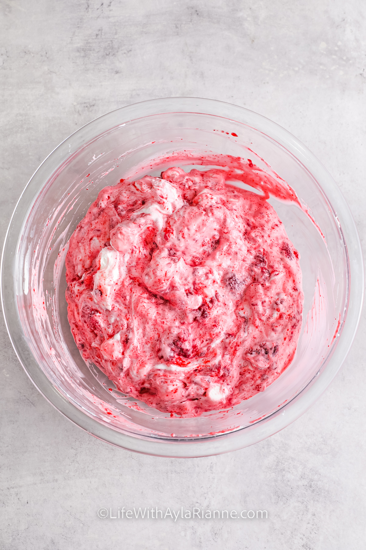 mixed ingredients to make Raspberry Fluff Salad
