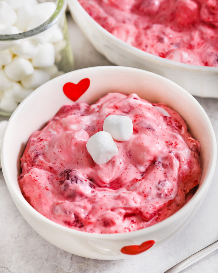 easy Raspberry Fluff Salad in a decorated heart bowl