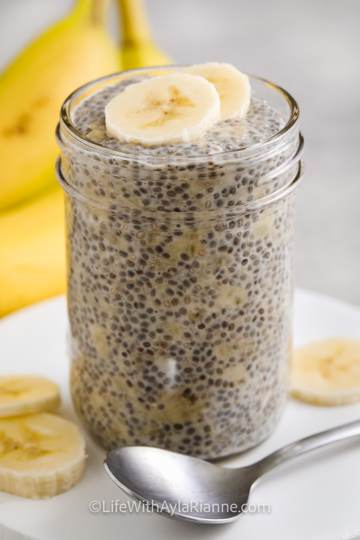 banana chia pudding in a jar with a spoon