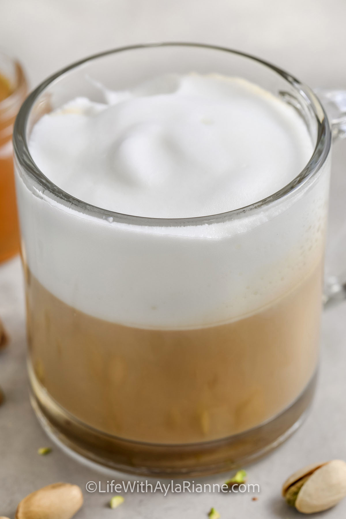 pistachio latte in a clear mug