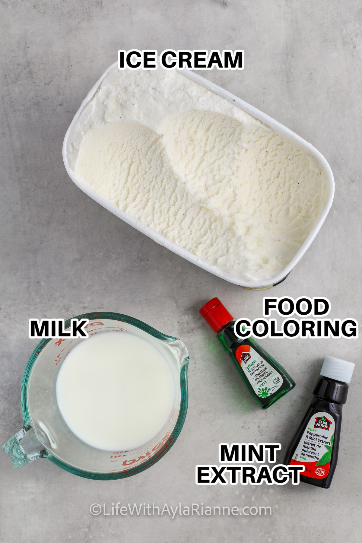 Ingredients to make a copycat shamrock shake labeled: ice cream, milk, food coloring, and mint extract. 