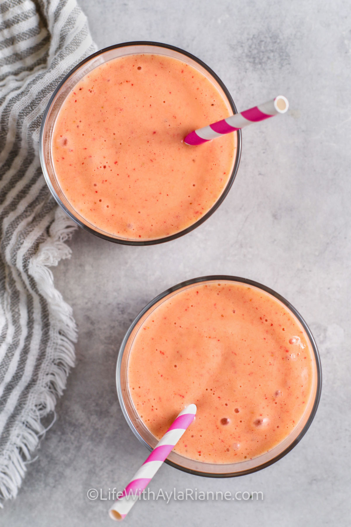 Strawberry Mango Smoothies in glasses with straws