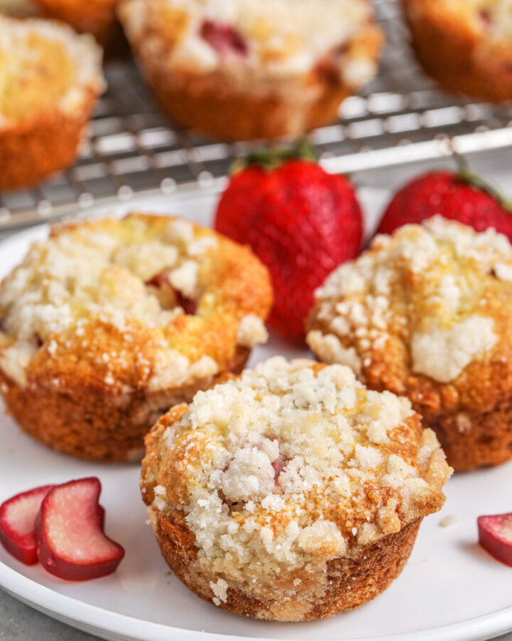 a plate of strawberry rhubarb muffins