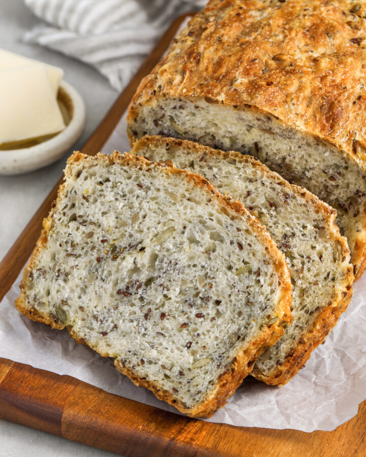 a sliced loaf of seed bread