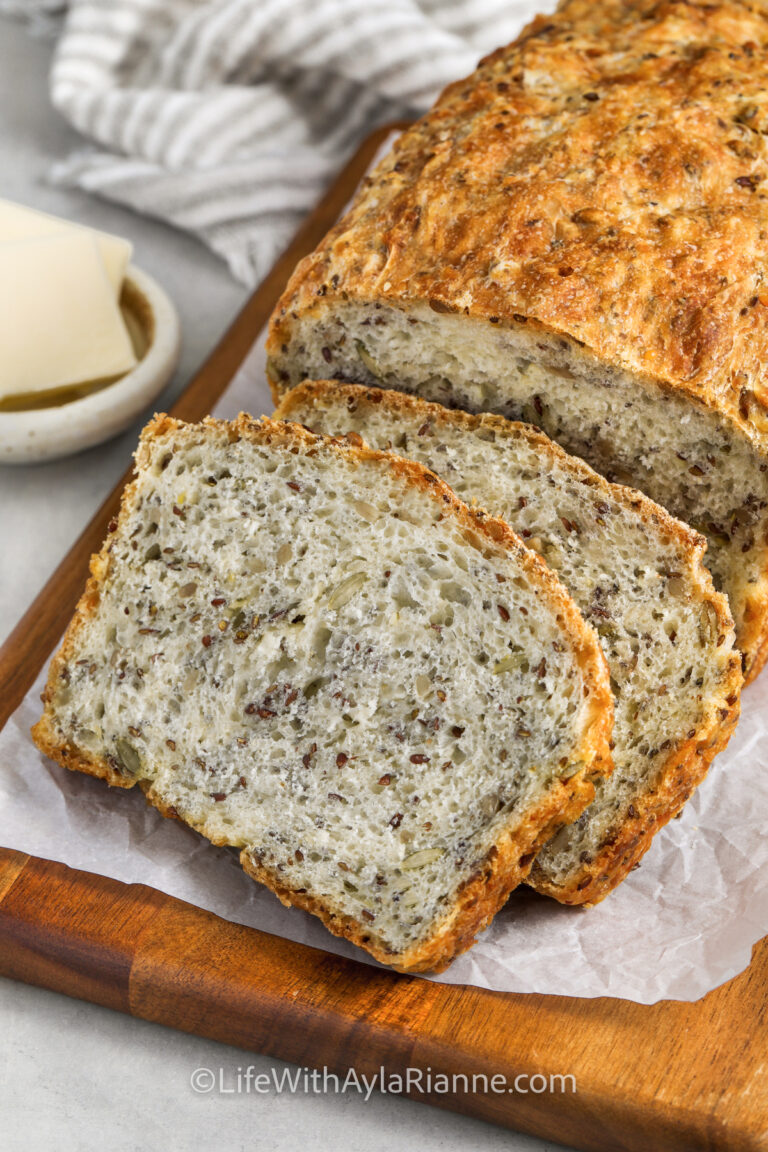 a sliced loaf of seed bread