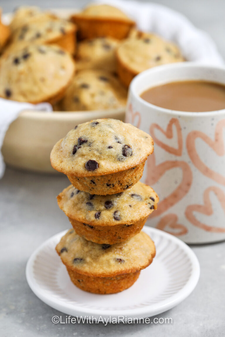 Mini Chocolate Chip Muffins in a stack on a plate with bowl full in the back