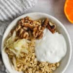 Princess Diana Oats in a bowl with oranges and a napkin