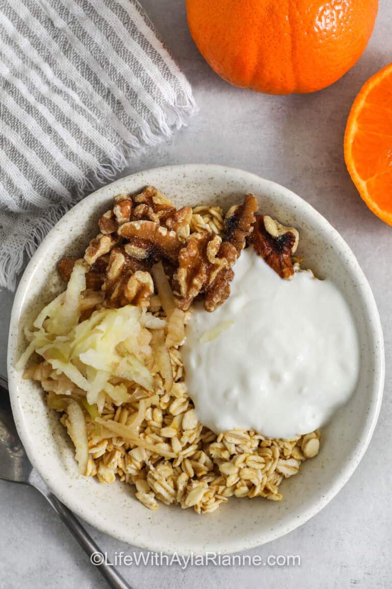 Princess Diana Oats in a bowl with oranges and a napkin