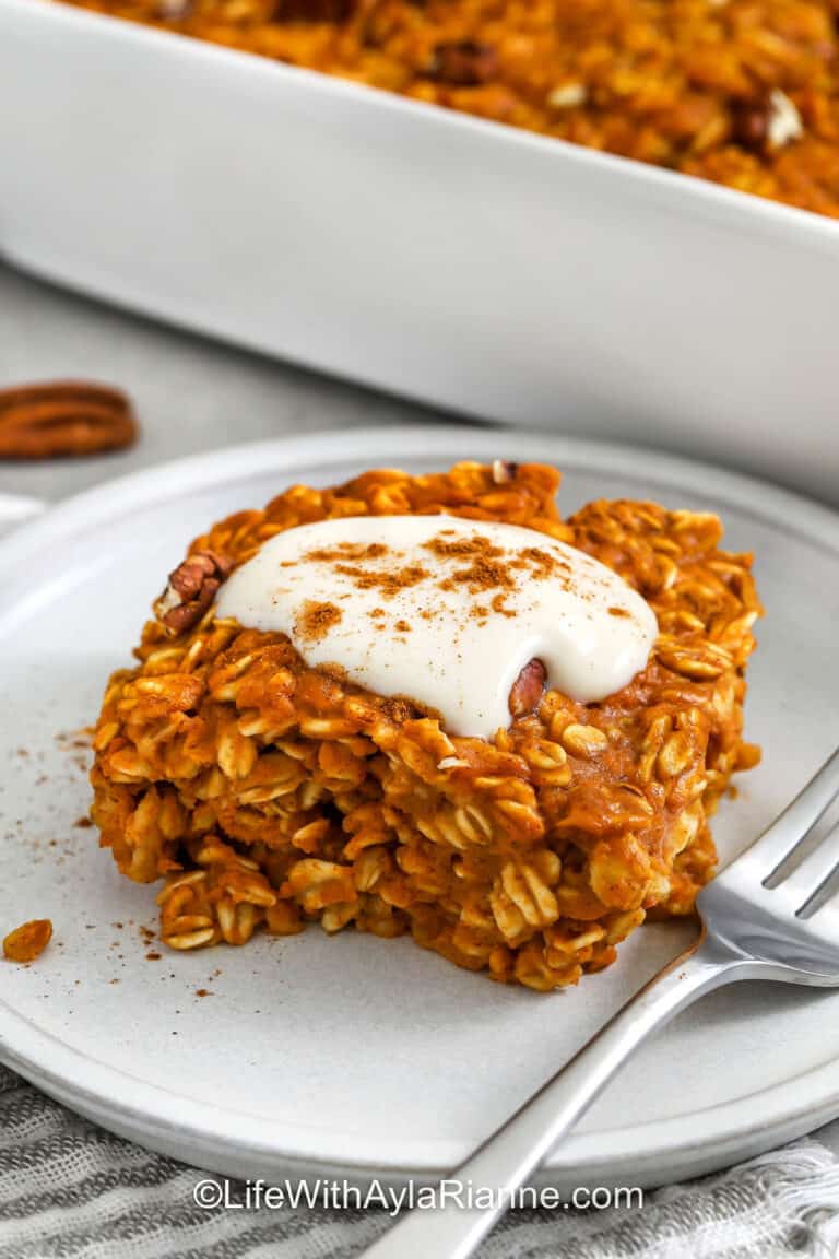 close up of a slice of Pumpkin Pie Baked Oatmeal with icing and a fork
